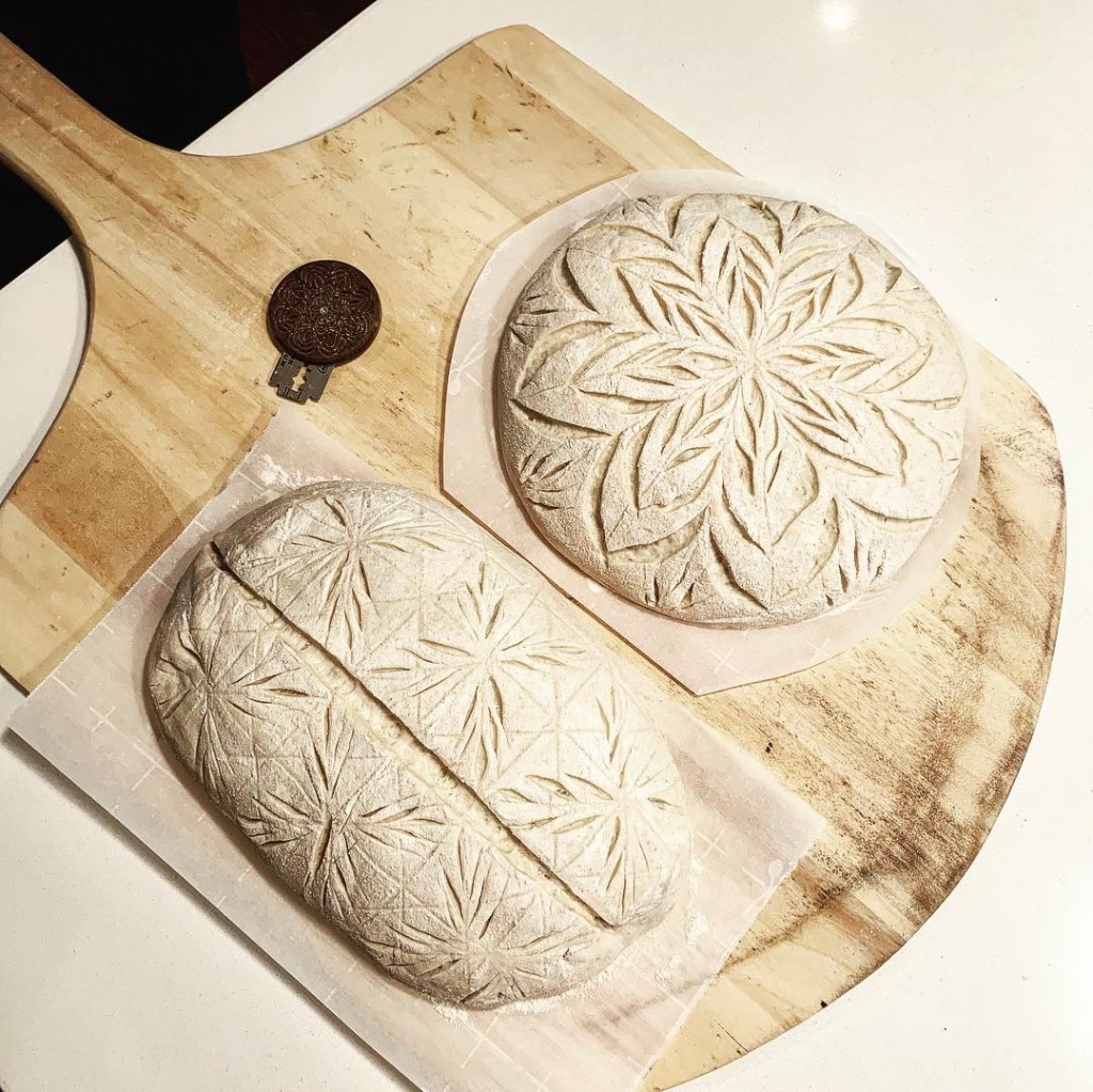 First 4 loaves are freehand scoring, next four are with homemade stencils.  All used the same recipe. : r/Sourdough